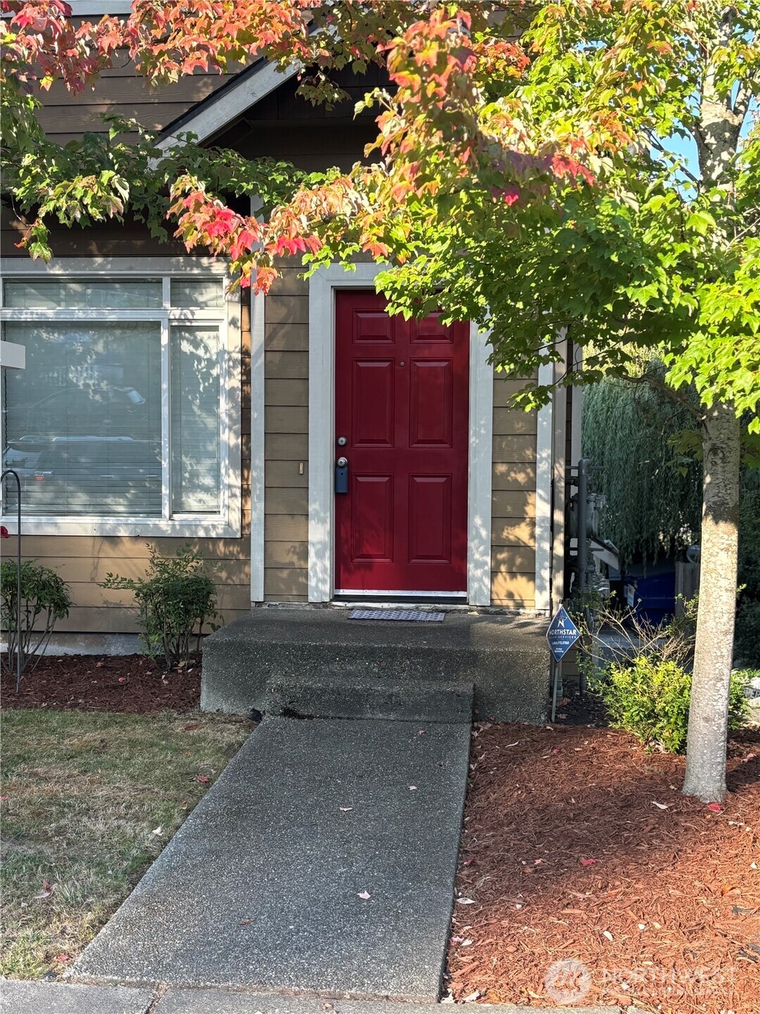 13005 64th Avenue South, Unit B117 Seattle, WA 98178 - Photo 1 of 37 a view of a house with a yard