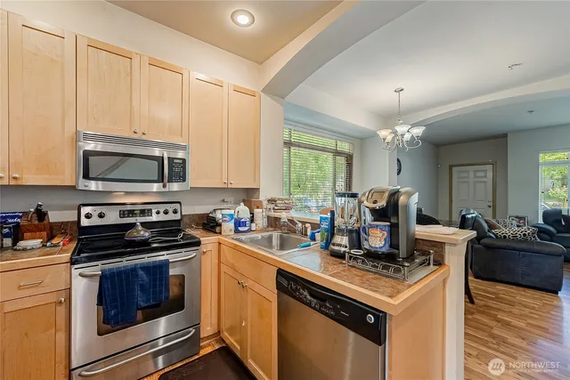a kitchen with a stove and a microwave
