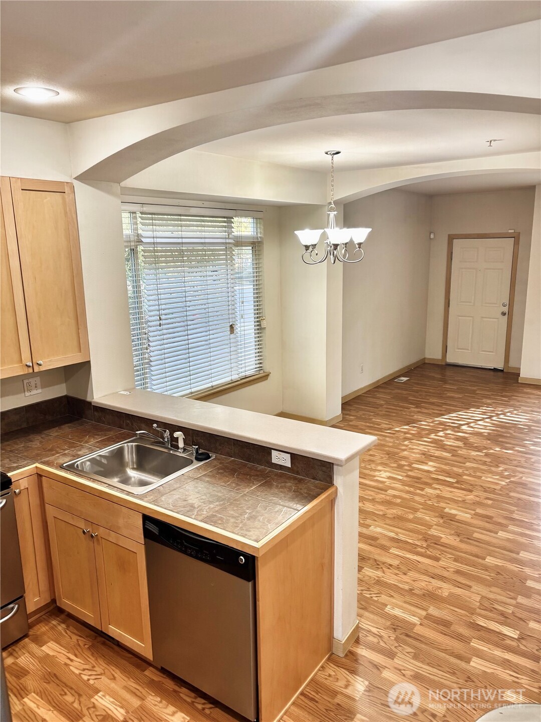 13005 64th Avenue South, Unit B117 Seattle, WA 98178 - Photo 16 of 37 a kitchen with granite countertop a sink and a stove