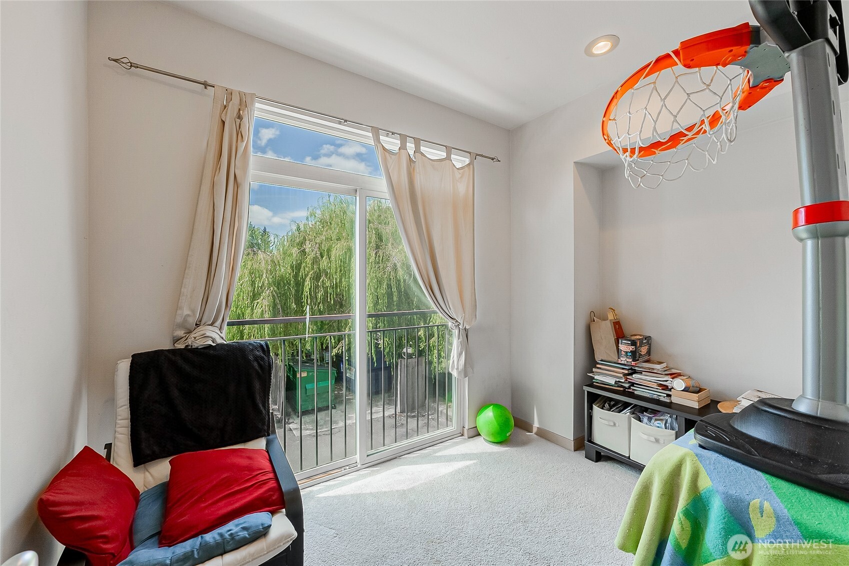 13005 64th Avenue South, Unit B117 Seattle, WA 98178 - Photo 19 of 37 a living room with furniture and a large window