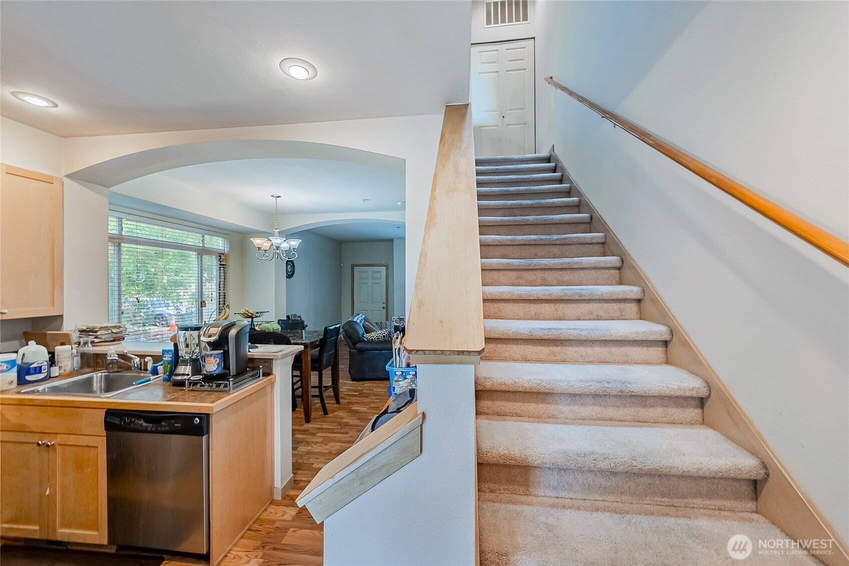 13005 64th Avenue South, Unit B117 Seattle, WA 98178 - Photo 23 of 37 a view of dining room and hall with wooden floor