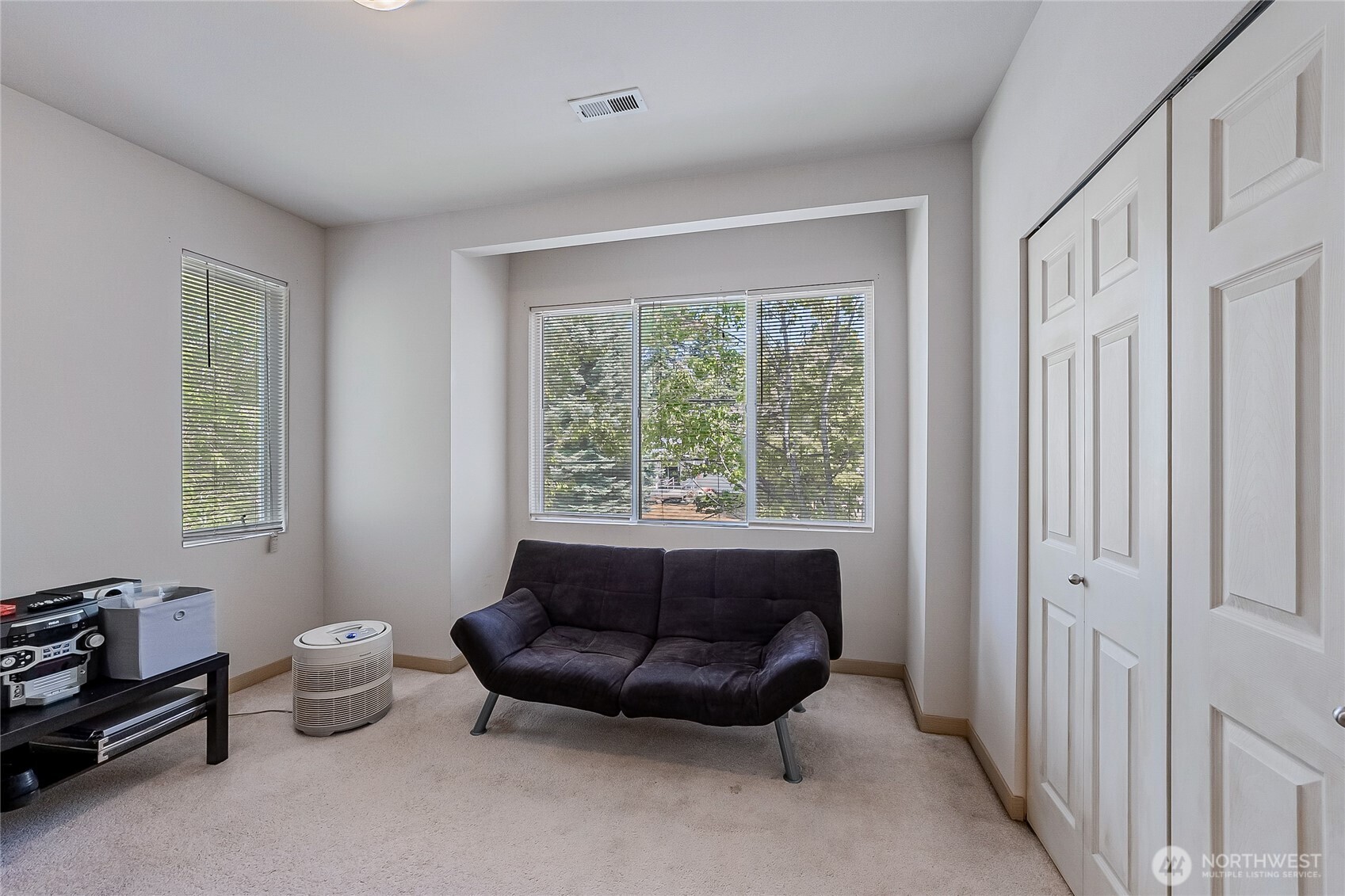 13005 64th Avenue South, Unit B117 Seattle, WA 98178 - Photo 31 of 37 a living room with furniture and a window