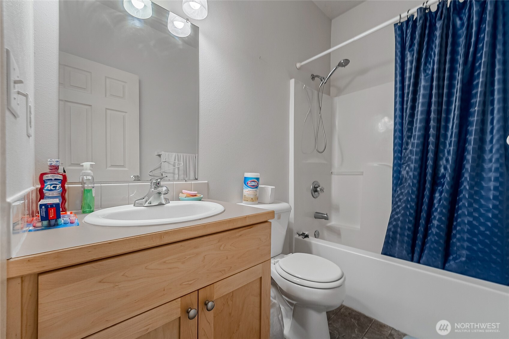 13005 64th Avenue South, Unit B117 Seattle, WA 98178 - Photo 32 of 37 a bathroom with a sink toilet vanity and shower