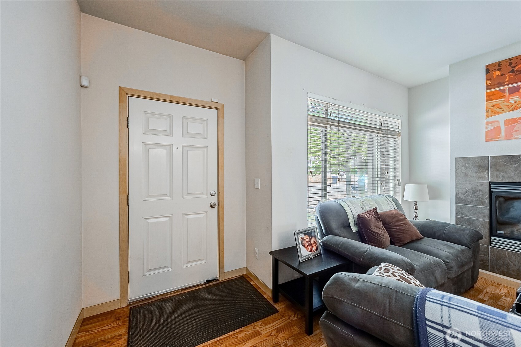 13005 64th Avenue South, Unit B117 Seattle, WA 98178 - Photo 4 of 37 a living room with furniture and a window