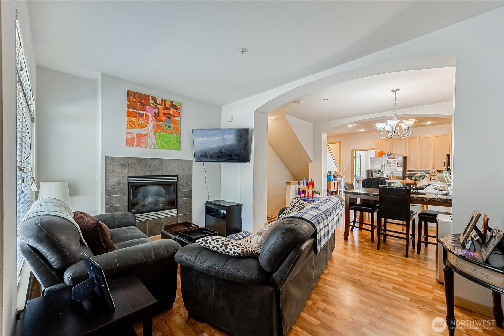 13005 64th Avenue South, Unit B117 Seattle, WA 98178 - Photo 5 of 37 a living room with furniture and a fireplace