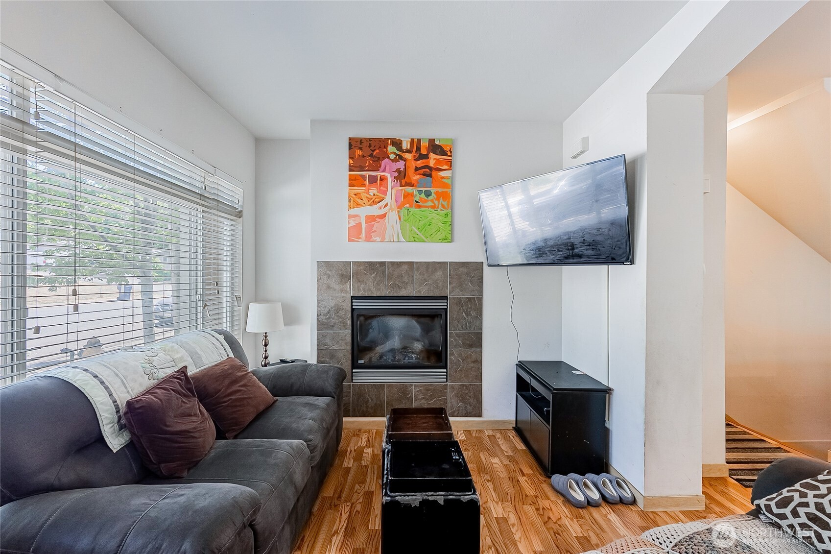 13005 64th Avenue South, Unit B117 Seattle, WA 98178 - Photo 6 of 37 a living room with furniture or couch and a fireplace