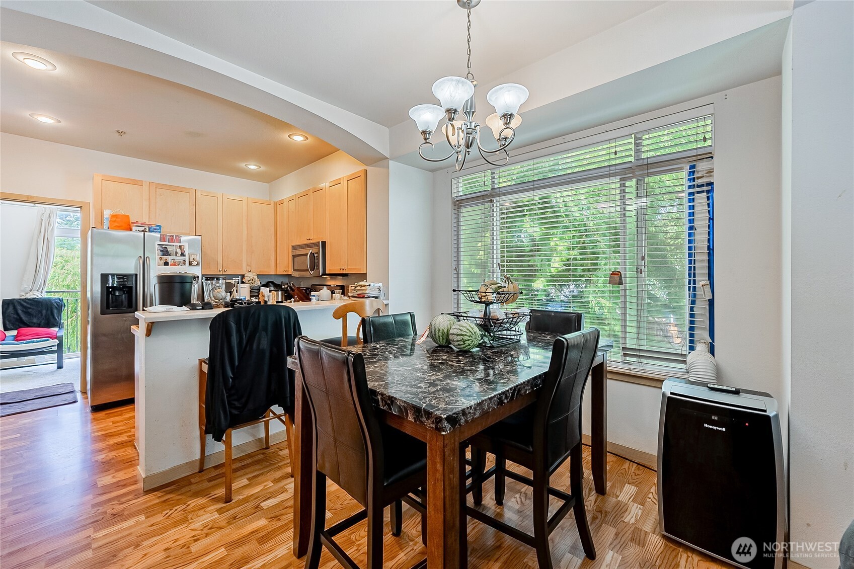13005 64th Avenue South, Unit B117 Seattle, WA 98178 - Photo 7 of 37 a view of a dining room with furniture window and outside view