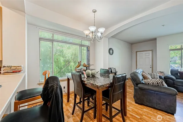a view of a dining room with furniture window and outside view