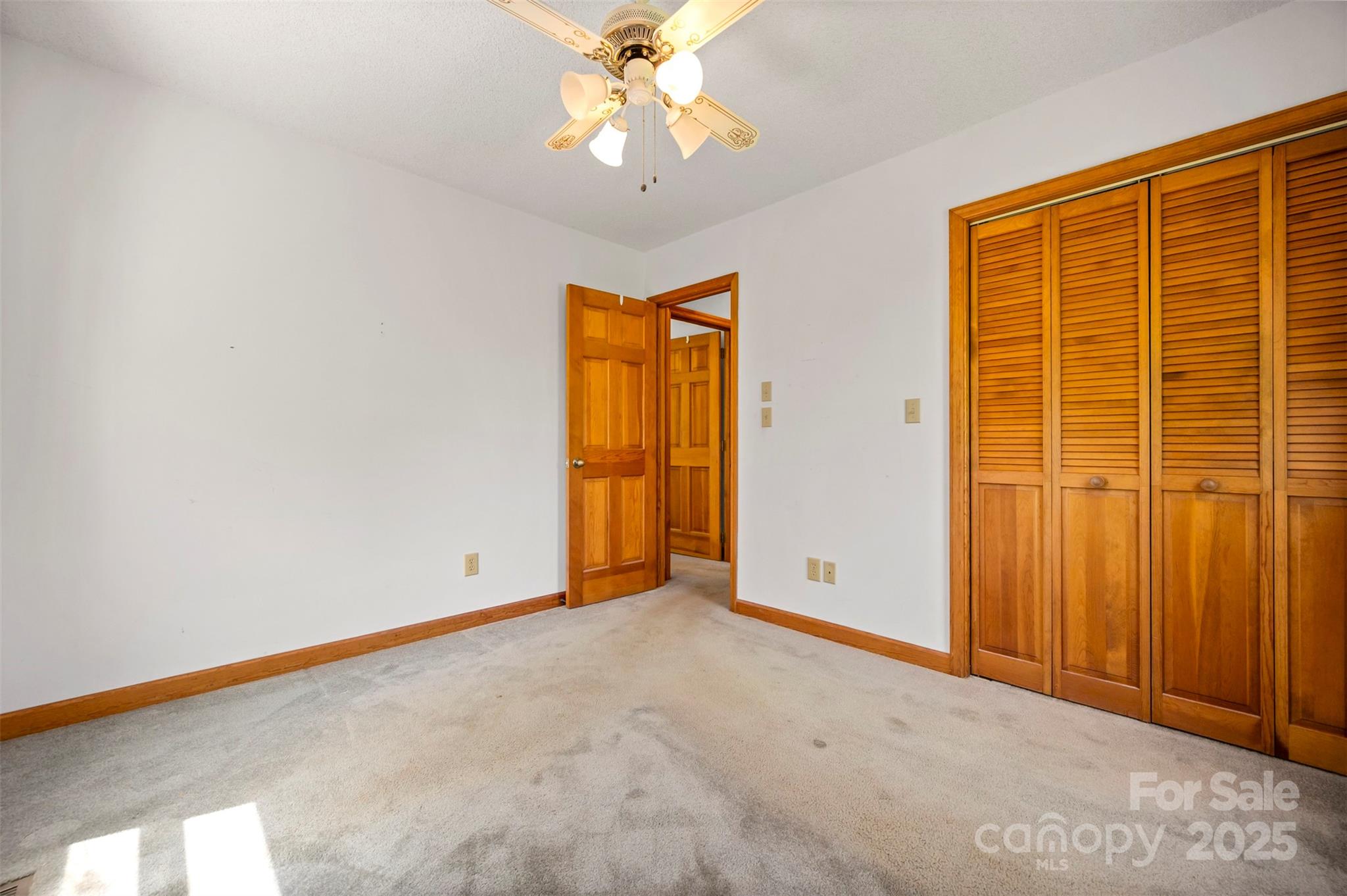 49 Meadowbrook Road Rutherfordton, NC 28139 - Photo 12 of 34 an empty room with windows and closet area
