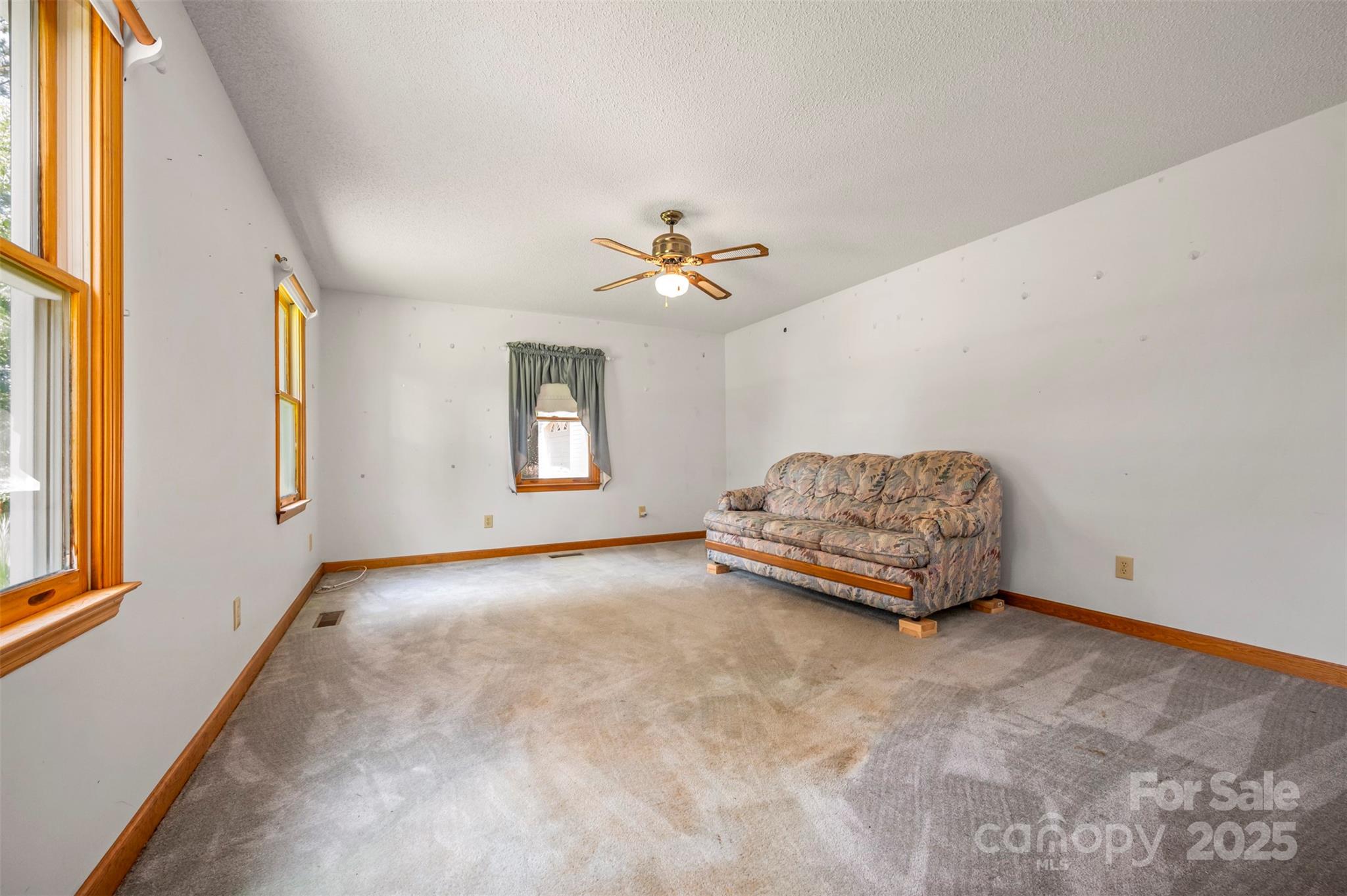 49 Meadowbrook Road Rutherfordton, NC 28139 - Photo 17 of 34 a living room with furniture and a ceiling fan