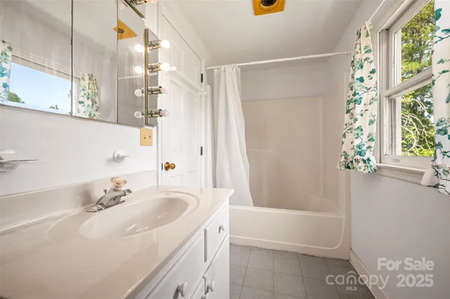 a bathroom with a sink and a bathtub