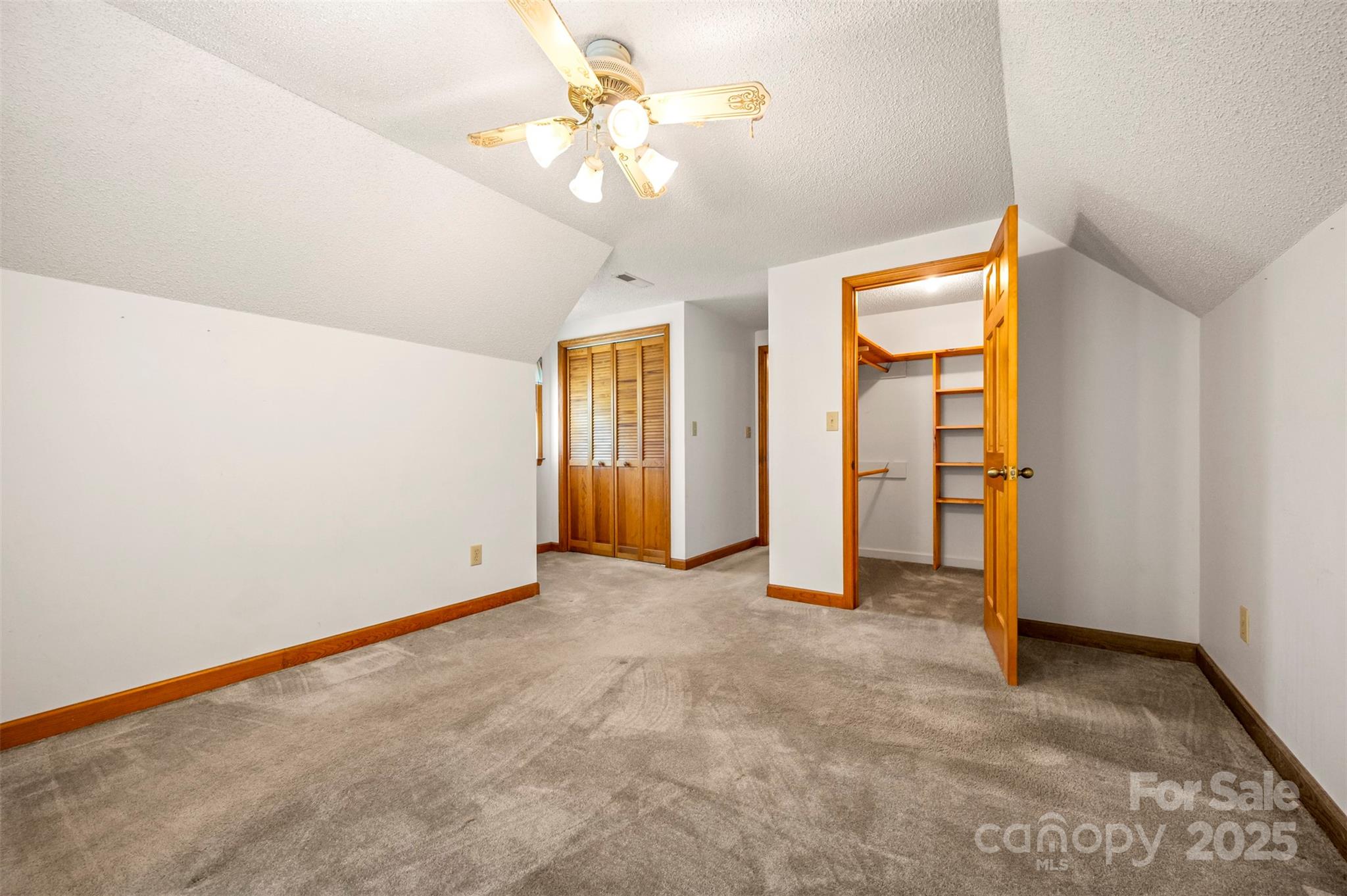 49 Meadowbrook Road Rutherfordton, NC 28139 - Photo 23 of 34 an empty room with closet and a chandelier fan