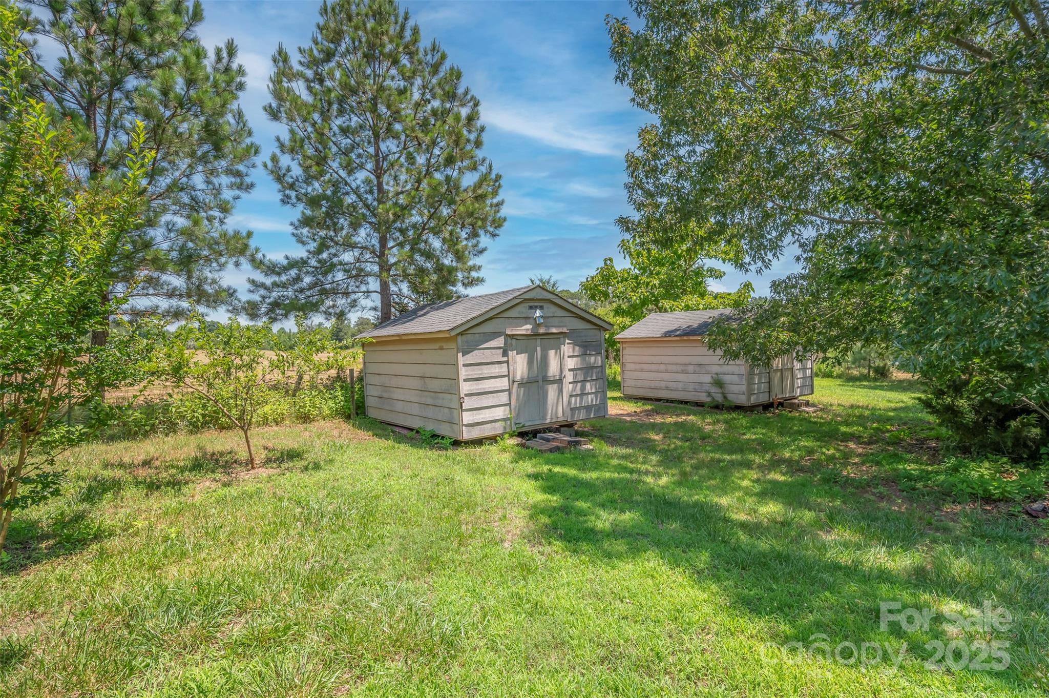 49 Meadowbrook Road Rutherfordton, NC 28139 - Photo 29 of 34 a view of a wooden house with a big yard and large trees