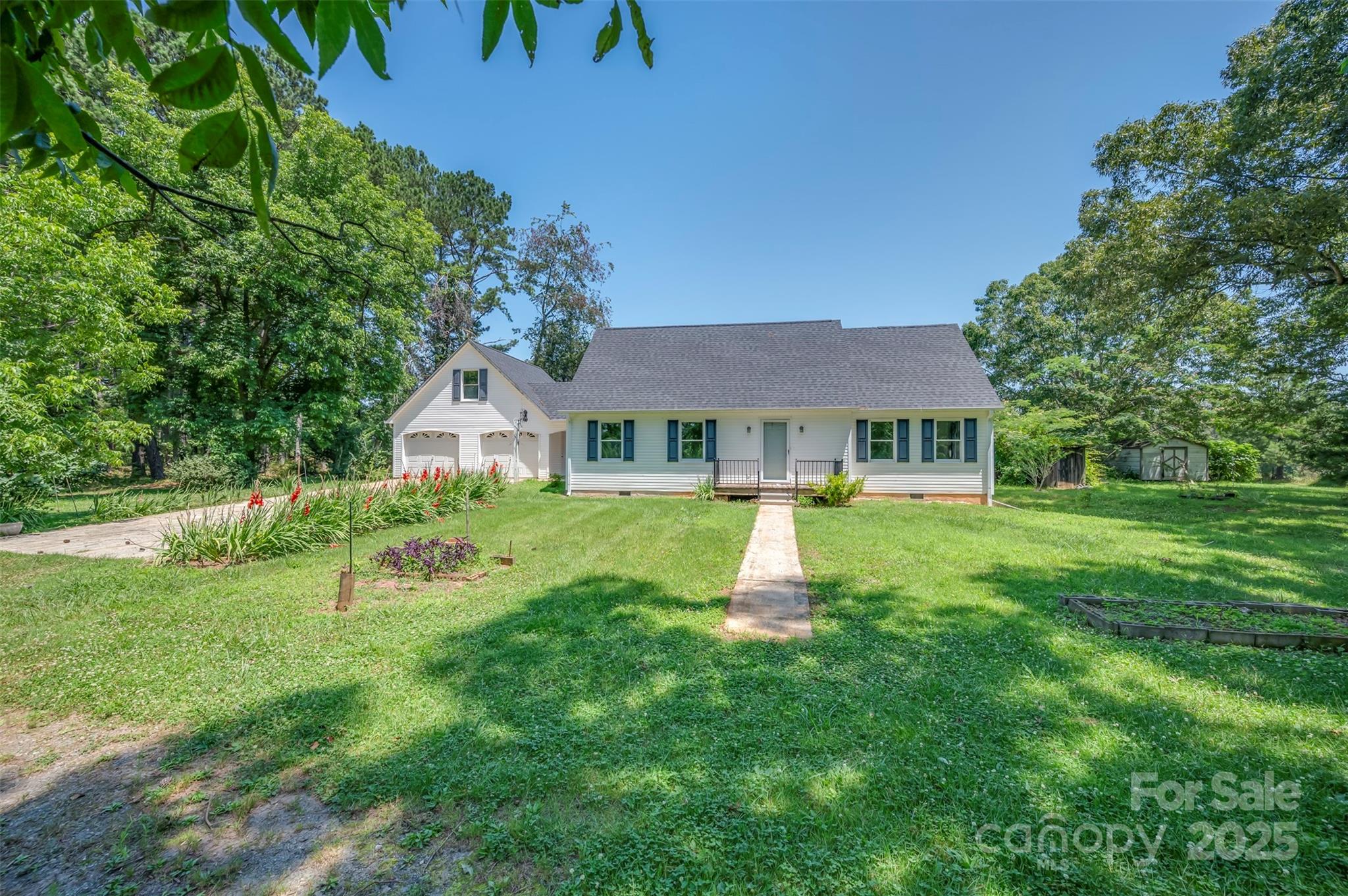 49 Meadowbrook Road Rutherfordton, NC 28139 - Photo 3 of 34 a front view of house with a garden and swimming pool