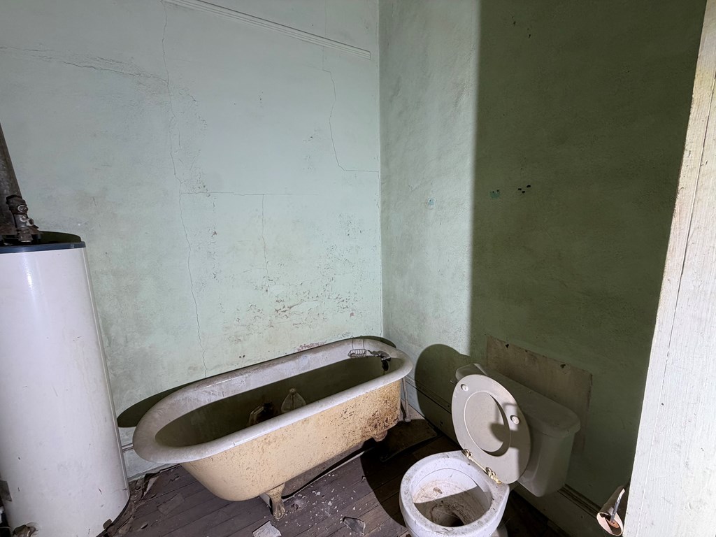 1124 20th Street Columbus, GA 31901 - Photo 26 of 30 a bathroom with a toilet and a sink