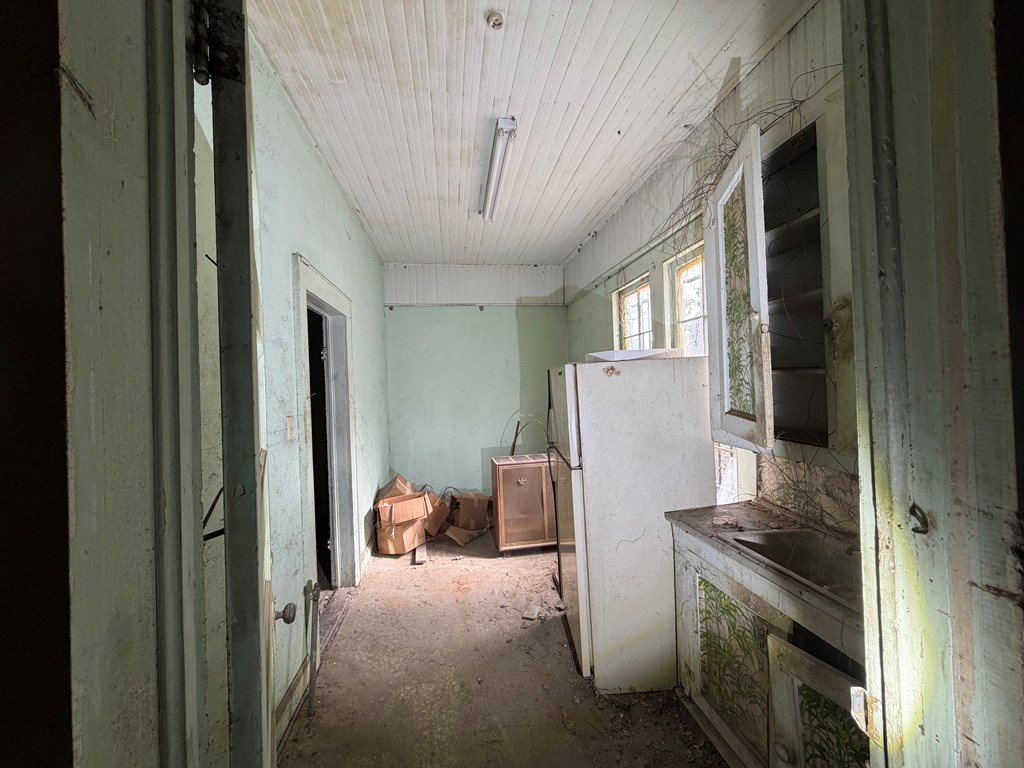 1124 20th Street Columbus, GA 31901 - Photo 30 of 30 a kitchen with stainless steel appliances granite countertop a refrigerator and a stove top oven