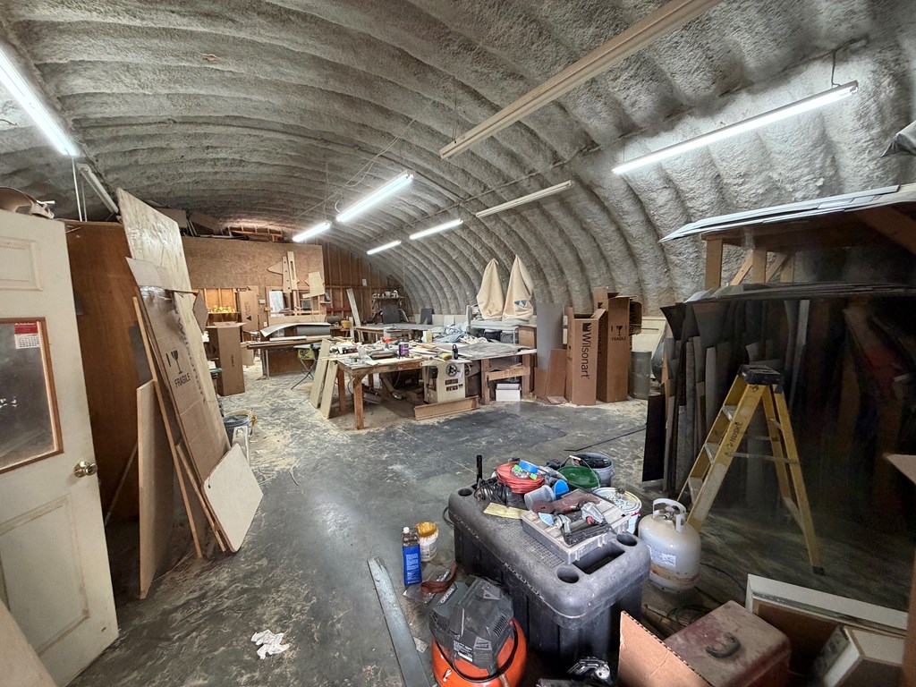 1124 20th Street Columbus, GA 31901 - Photo 6 of 30 a living room with lots of furniture and clutter