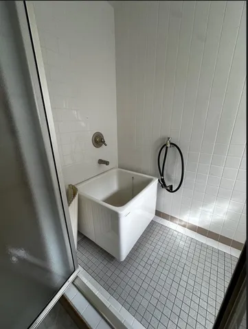 a bathroom with a bathtub and shower