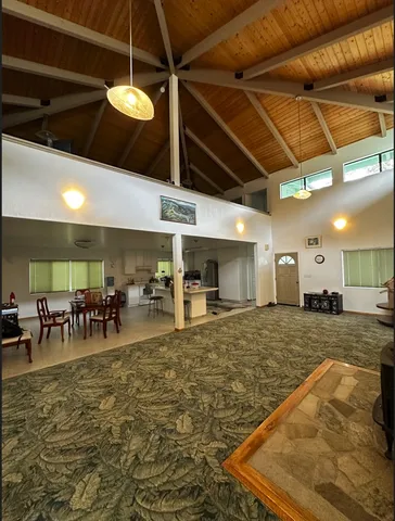 a large room with lots of tables and chairs