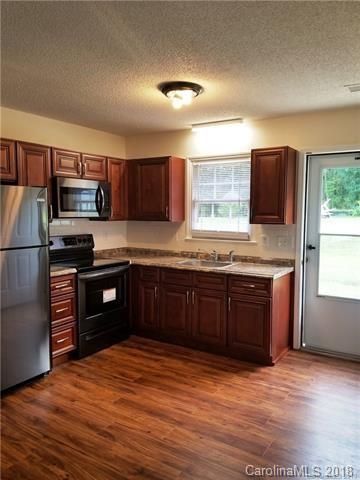 2286 Beth Haven Church Road, Unit 2286 Denver, NC 28037 - Photo 13 of 15 a kitchen with stainless steel appliances granite countertop a refrigerator stove and sink