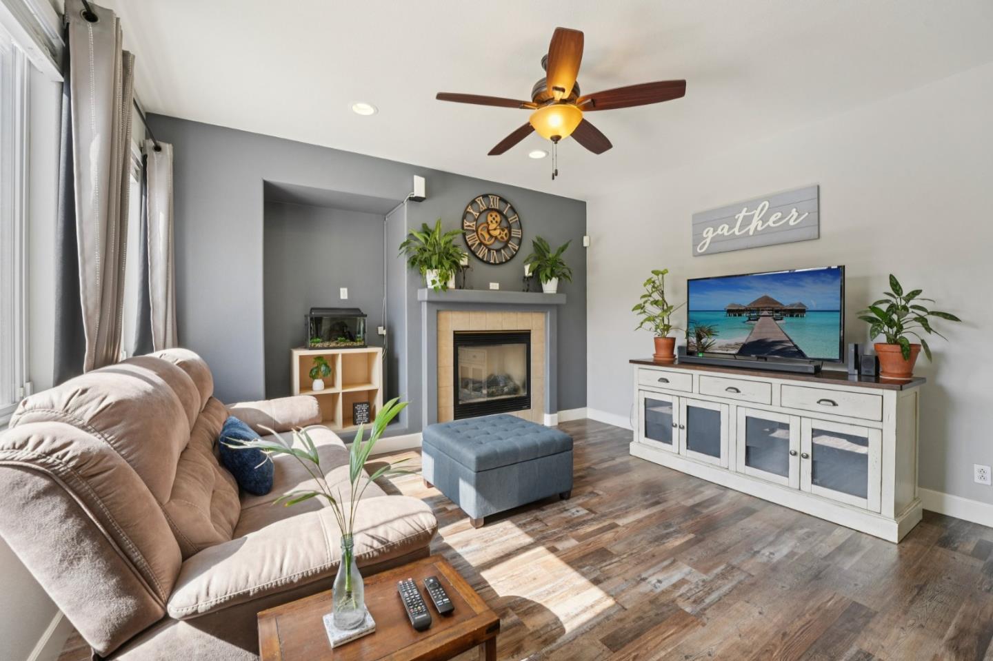476 Arcadia Way Salinas, CA 93906 - Photo 11 of 40 a living room with furniture a flat screen tv and a fireplace