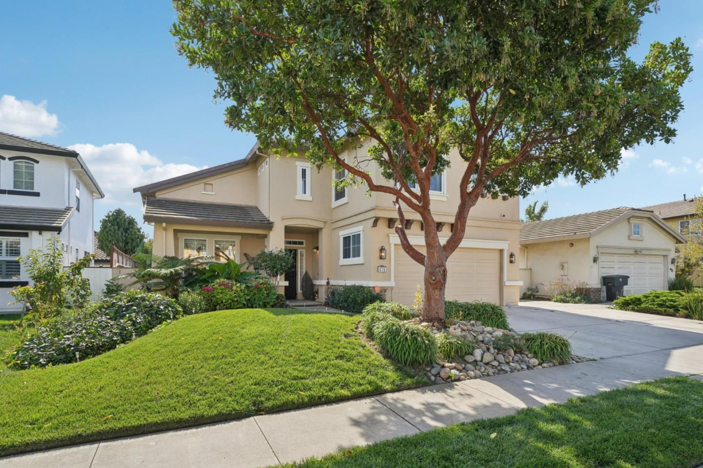 476 Arcadia Way Salinas, CA 93906 - Photo 2 of 40 a front view of a house with a yard and trees