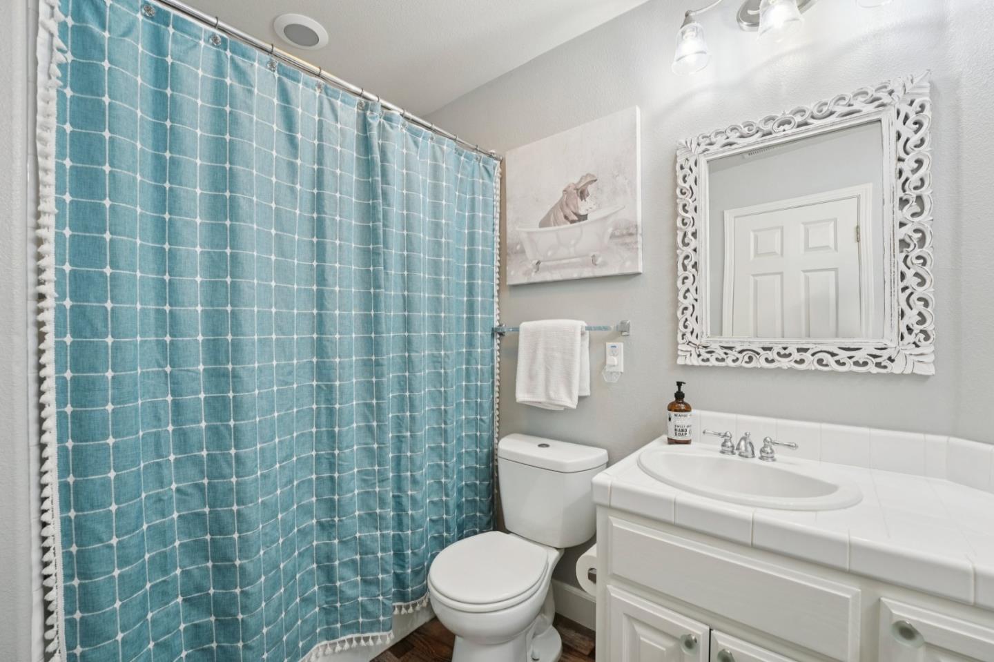 476 Arcadia Way Salinas, CA 93906 - Photo 28 of 40 a bathroom with a sink a toilet and a mirror