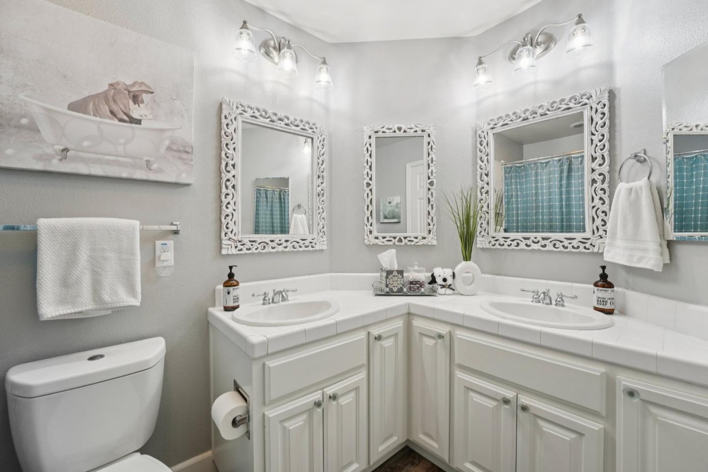 476 Arcadia Way Salinas, CA 93906 - Photo 29 of 40 a bathroom with a toilet sink and mirror