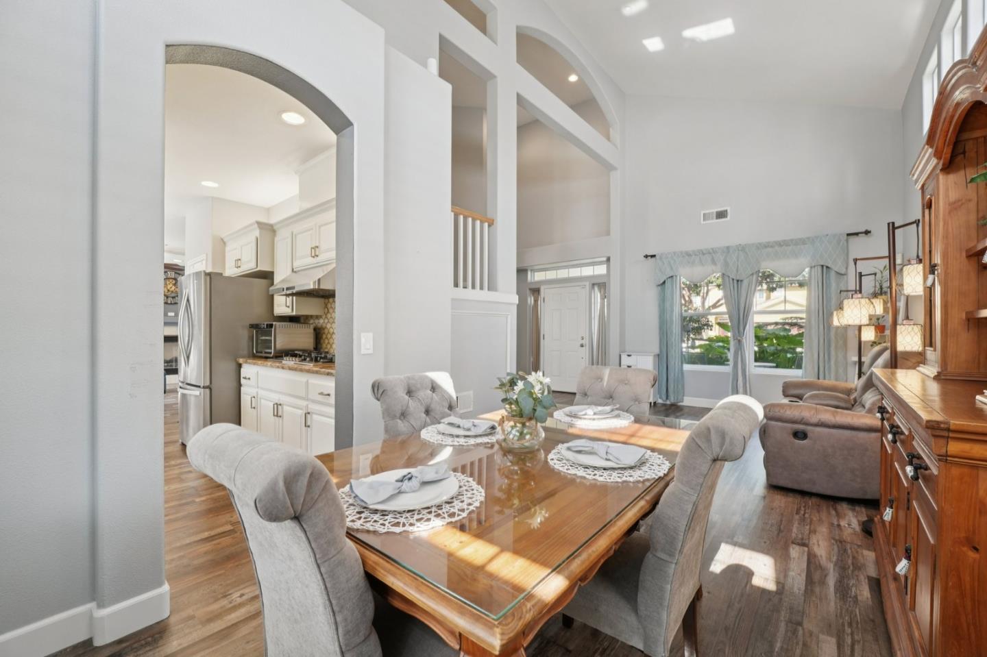 476 Arcadia Way Salinas, CA 93906 - Photo 6 of 40 a view of a dining room with furniture wooden floor and a chandelier