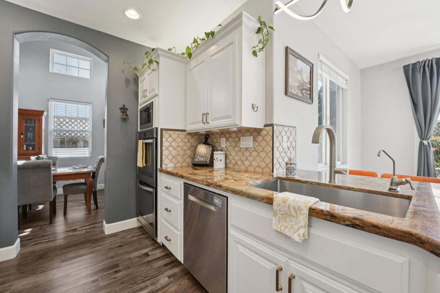 476 Arcadia Way Salinas, CA 93906 - Photo 7 of 40 a kitchen with stainless steel appliances granite countertop a sink stove and cabinets
