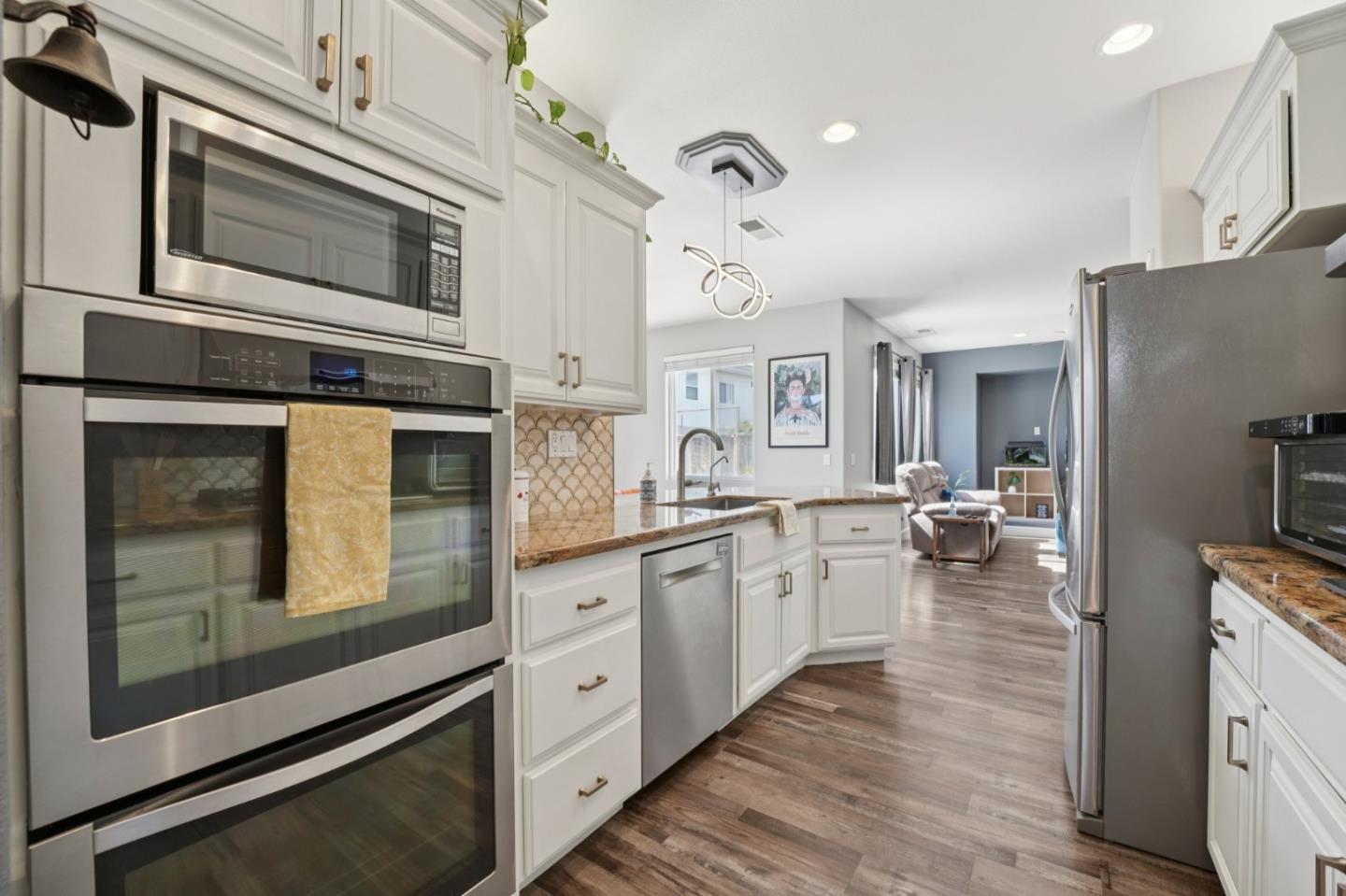 476 Arcadia Way Salinas, CA 93906 - Photo 8 of 40 a kitchen with sink cabinets and microwave