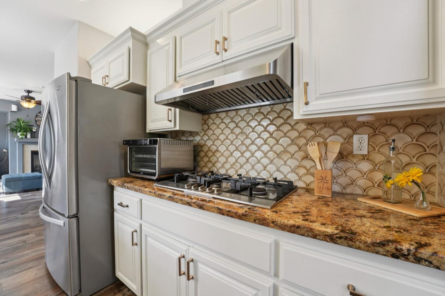 476 Arcadia Way Salinas, CA 93906 - Photo 10 of 40 a kitchen with stainless steel appliances granite countertop a sink a stove and a refrigerator