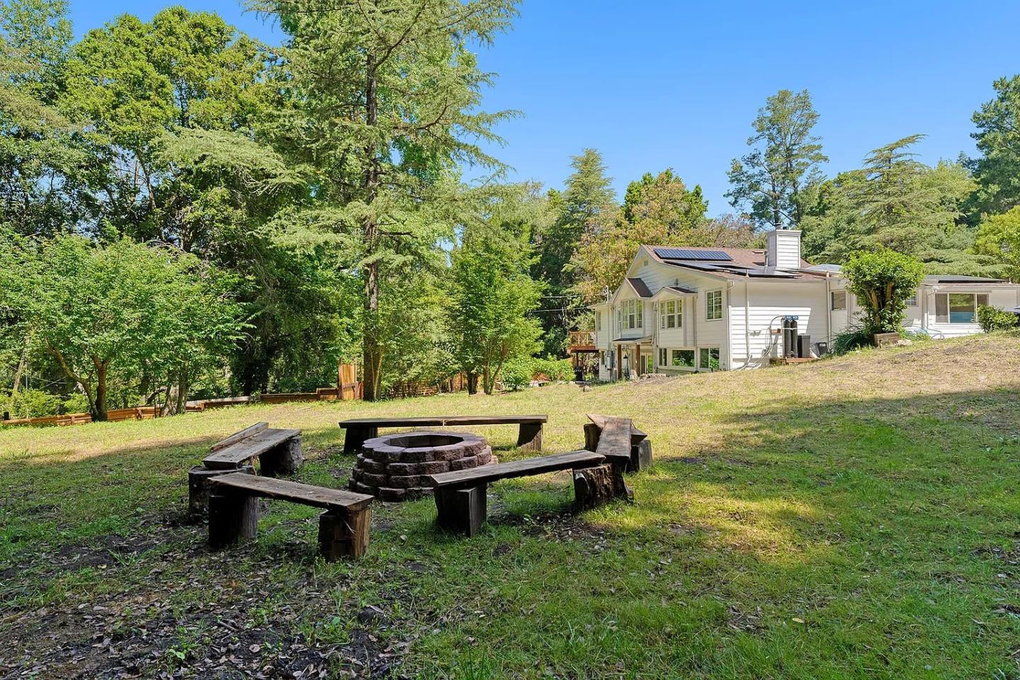 1003 Laurel Glen Road Soquel, CA 95073 - Photo 101 of 101 a backyard of a house with table and chairs