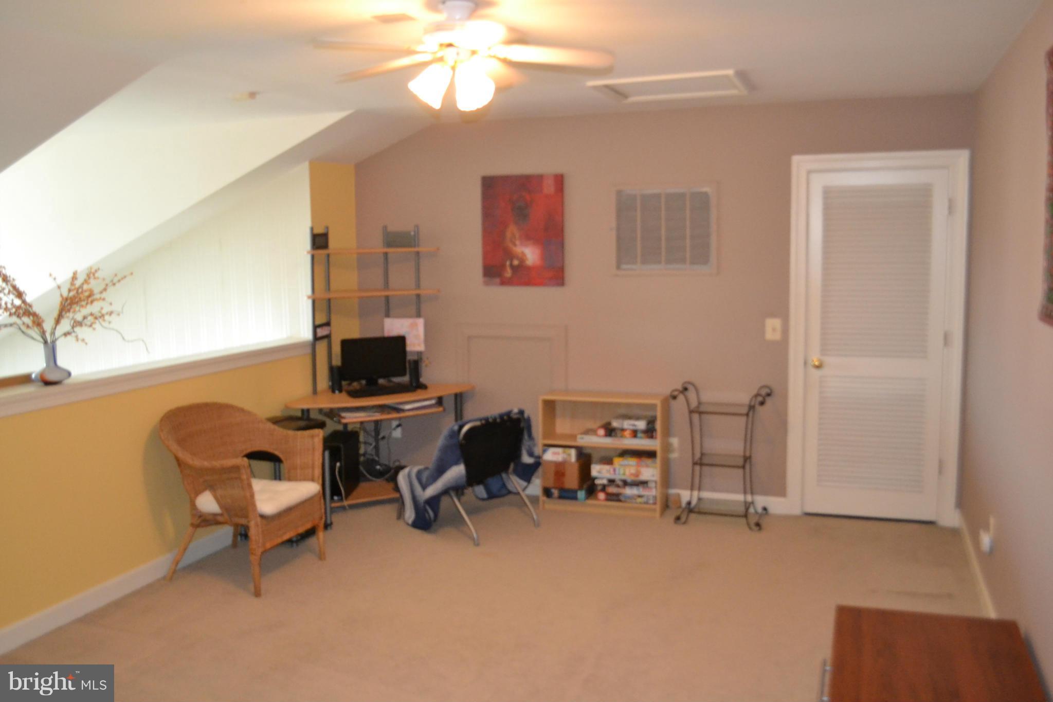 17045 Islip Loop, Unit 301 Dumfries, VA 22026 - Photo 12 of 14 a workspace with furniture and a window