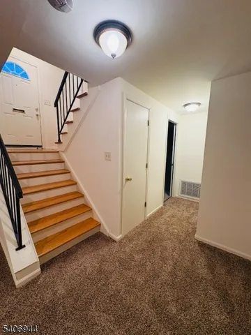 a view of a hallway with staircase