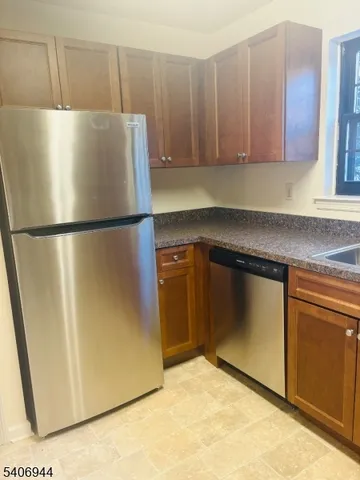 a white refrigerator freezer sitting in a kitchen