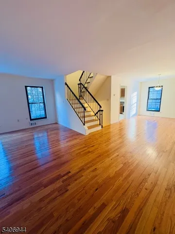a view of a livingroom with wooden floor