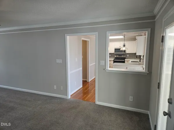 a kitchen with stainless steel appliances a refrigerator sink and cabinets
