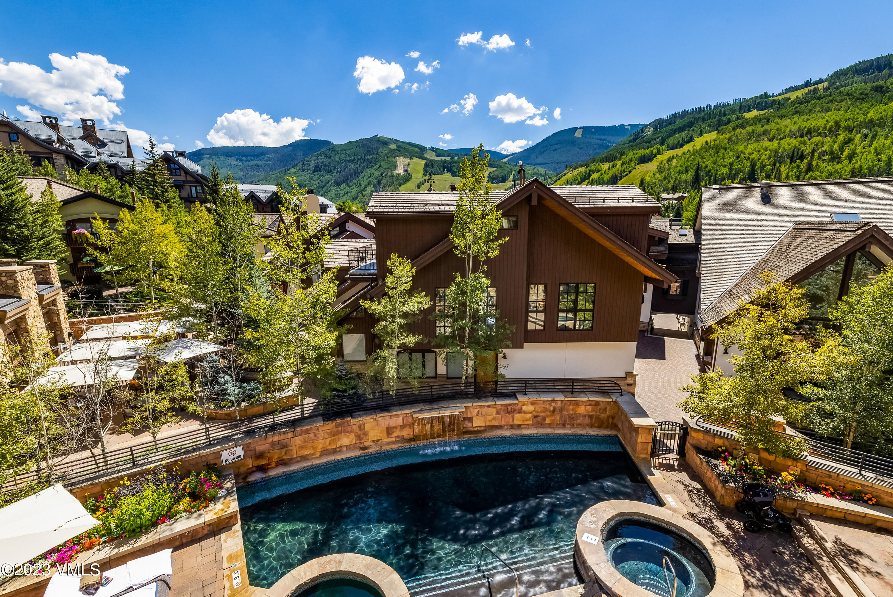 16 Vail Road, Unit RESORT MEMBERSHIP Vail, CO 81657 - Photo 15 of 51 a view of swimming pool with a patio