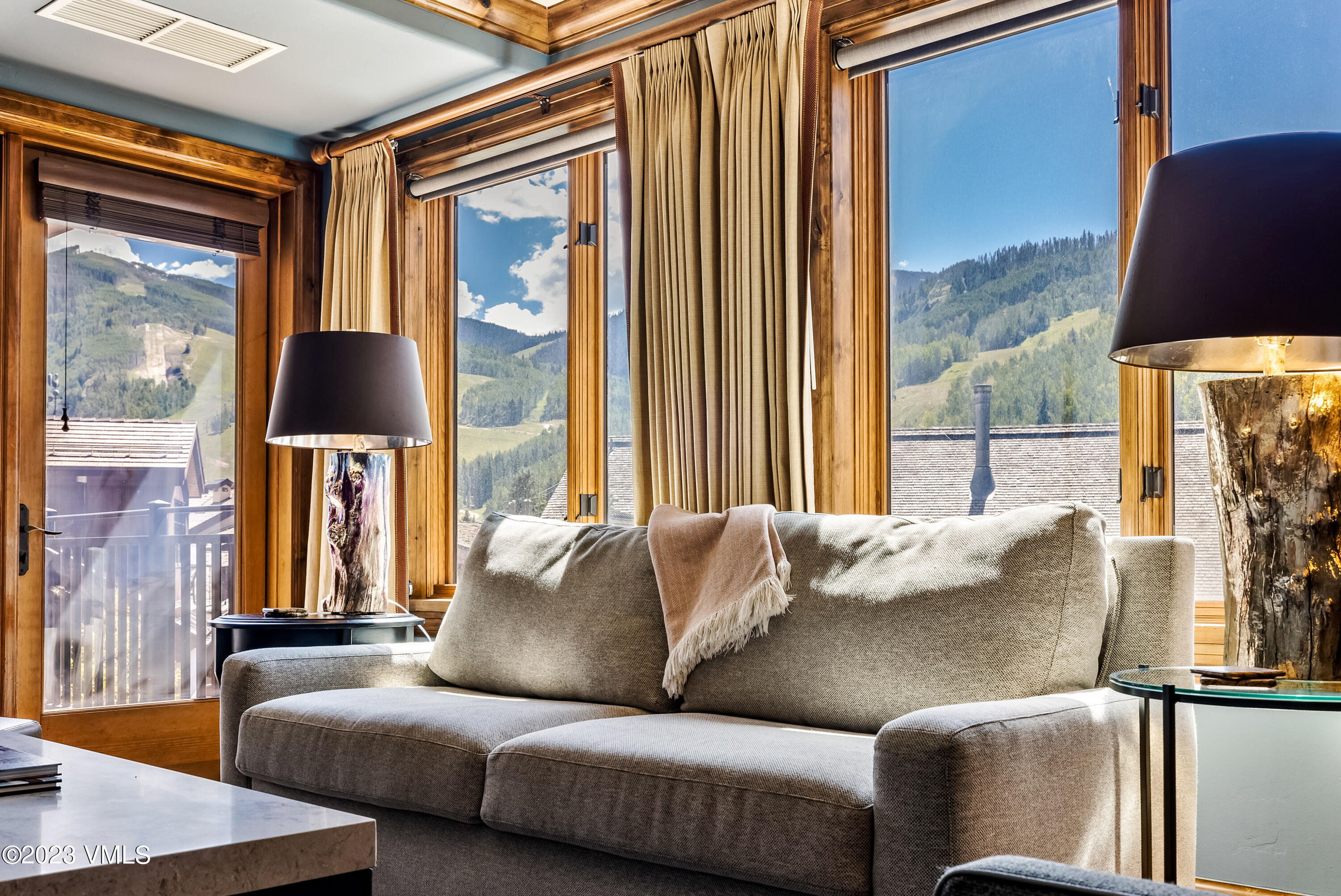 16 Vail Road, Unit RESORT MEMBERSHIP Vail, CO 81657 - Photo 2 of 51 a living room with furniture and a large window