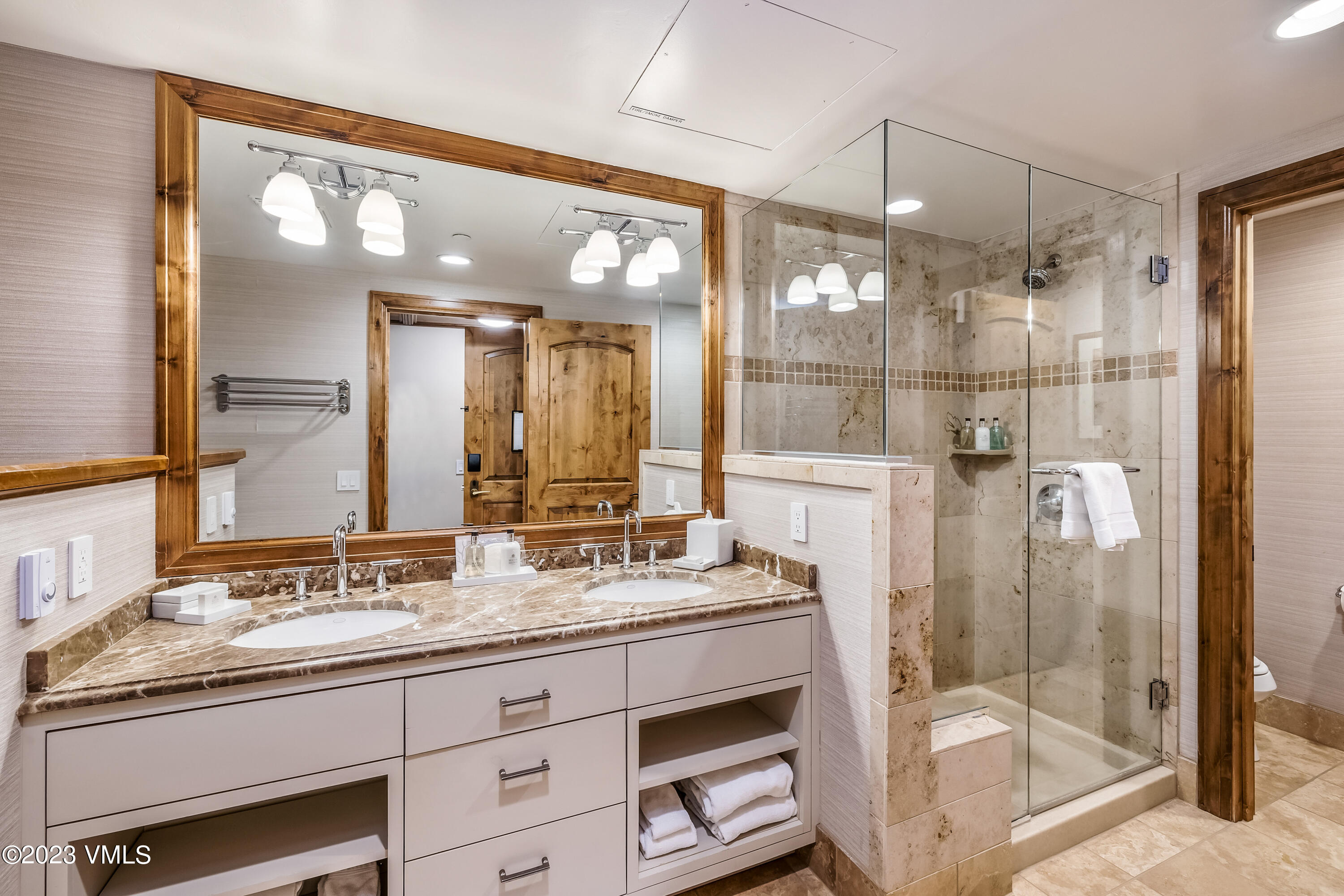 16 Vail Road, Unit RESORT MEMBERSHIP Vail, CO 81657 - Photo 21 of 51 a bathroom with a double vanity sink mirror and double
