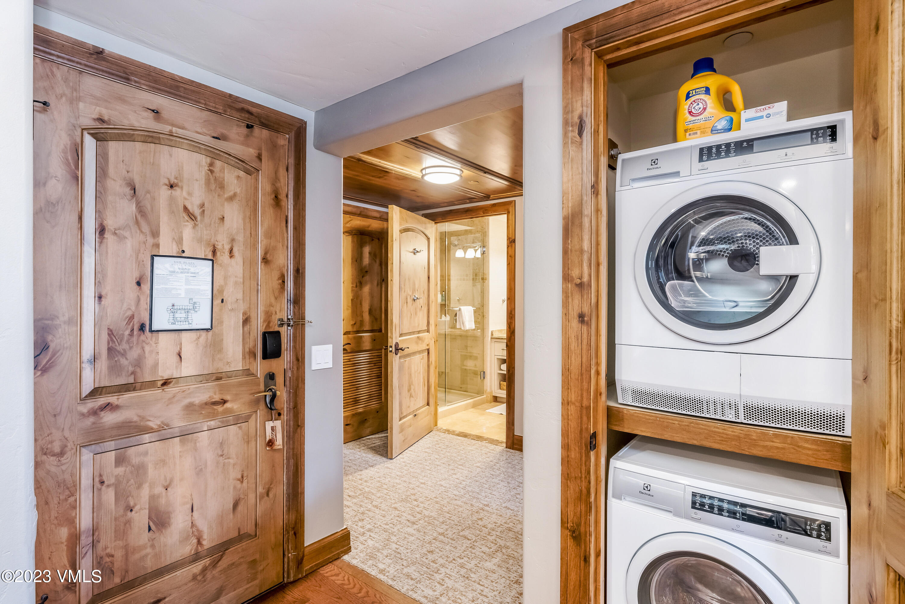 16 Vail Road, Unit RESORT MEMBERSHIP Vail, CO 81657 - Photo 25 of 51 a view of a hallway with washer and dryer