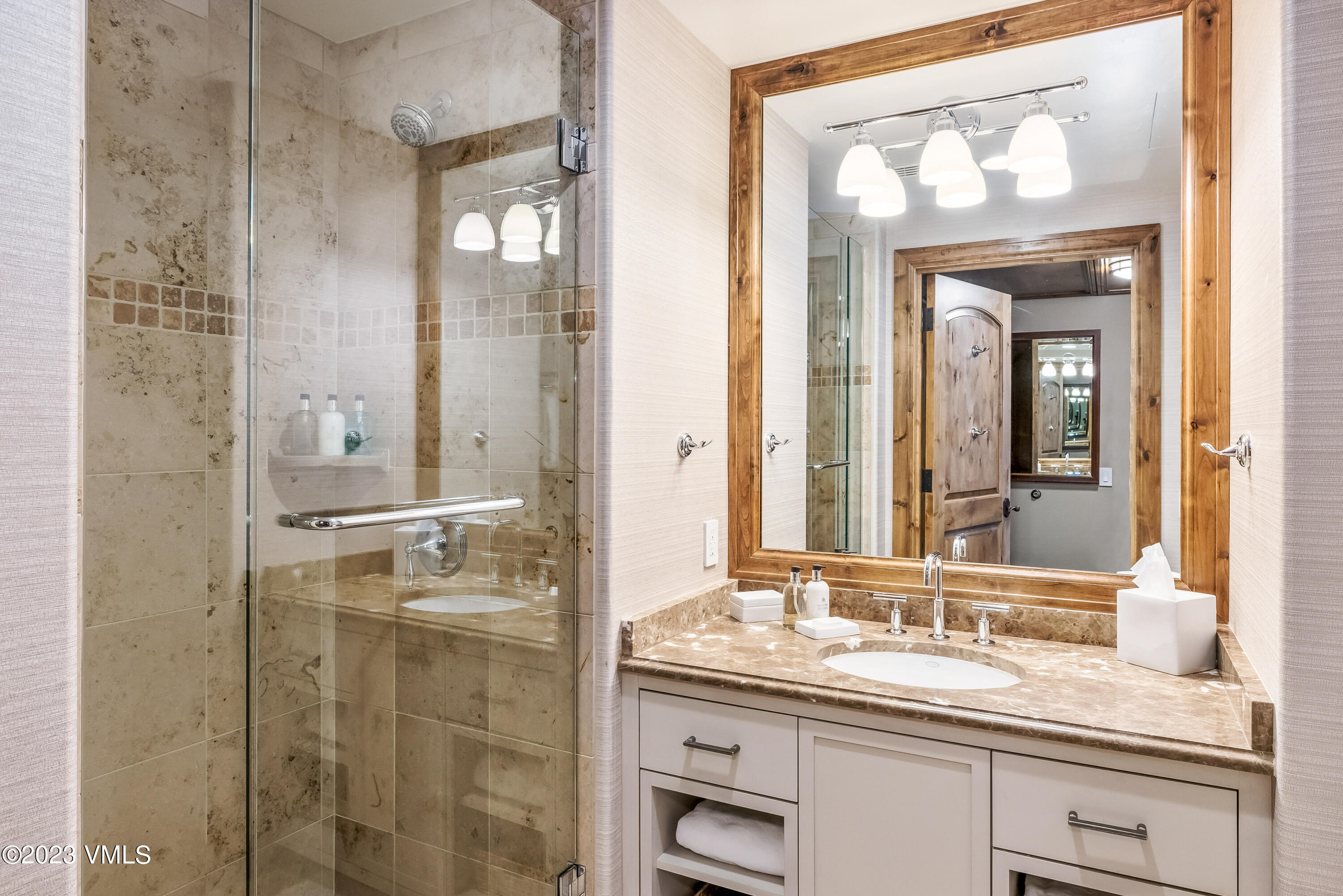 16 Vail Road, Unit RESORT MEMBERSHIP Vail, CO 81657 - Photo 26 of 51 a bathroom with a granite countertop sink a mirror and a shower