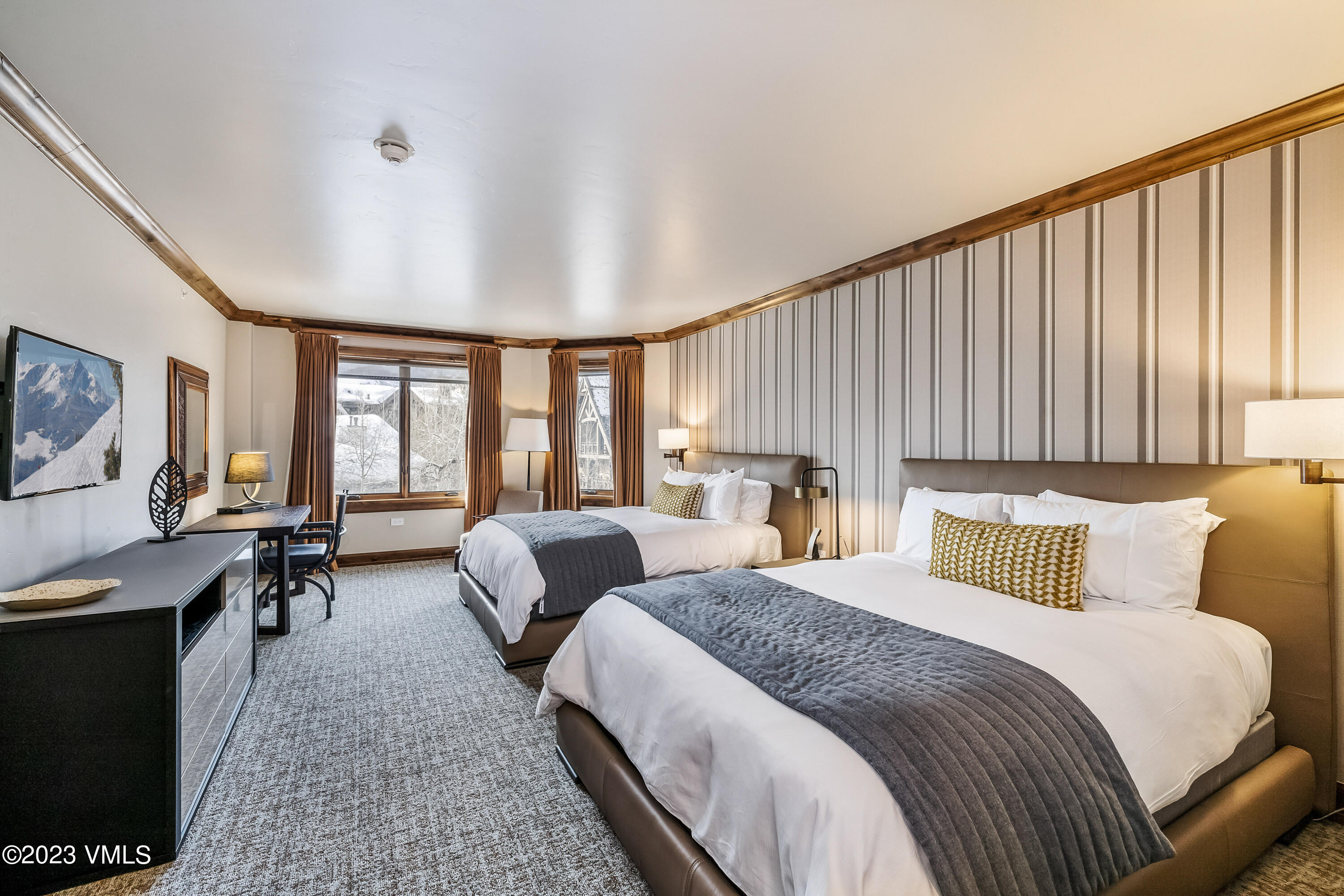 16 Vail Road, Unit RESORT MEMBERSHIP Vail, CO 81657 - Photo 29 of 51 a bedroom with two beds and large window