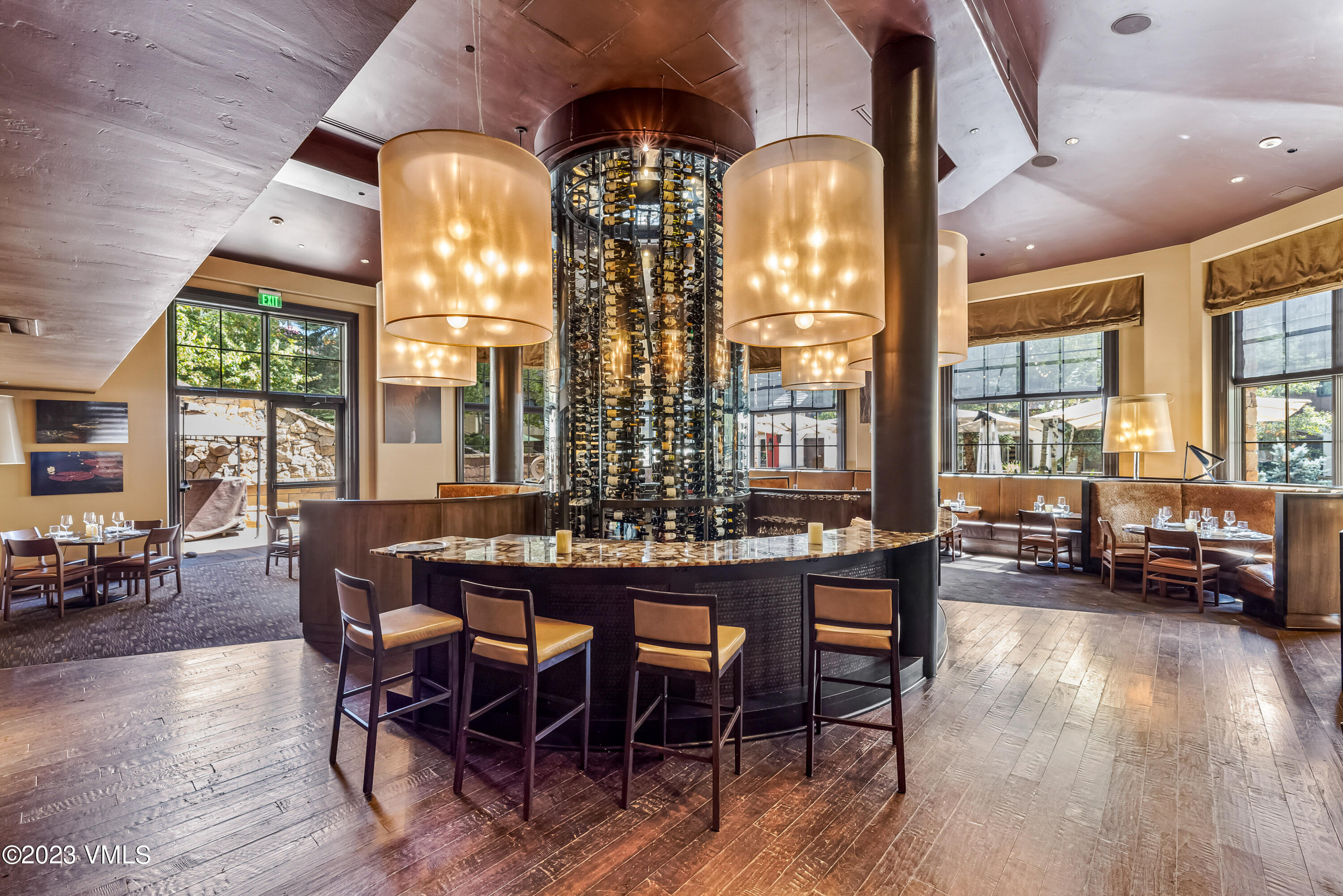 16 Vail Road, Unit RESORT MEMBERSHIP Vail, CO 81657 - Photo 37 of 51 a view of a dining room with furniture window and wooden floor
