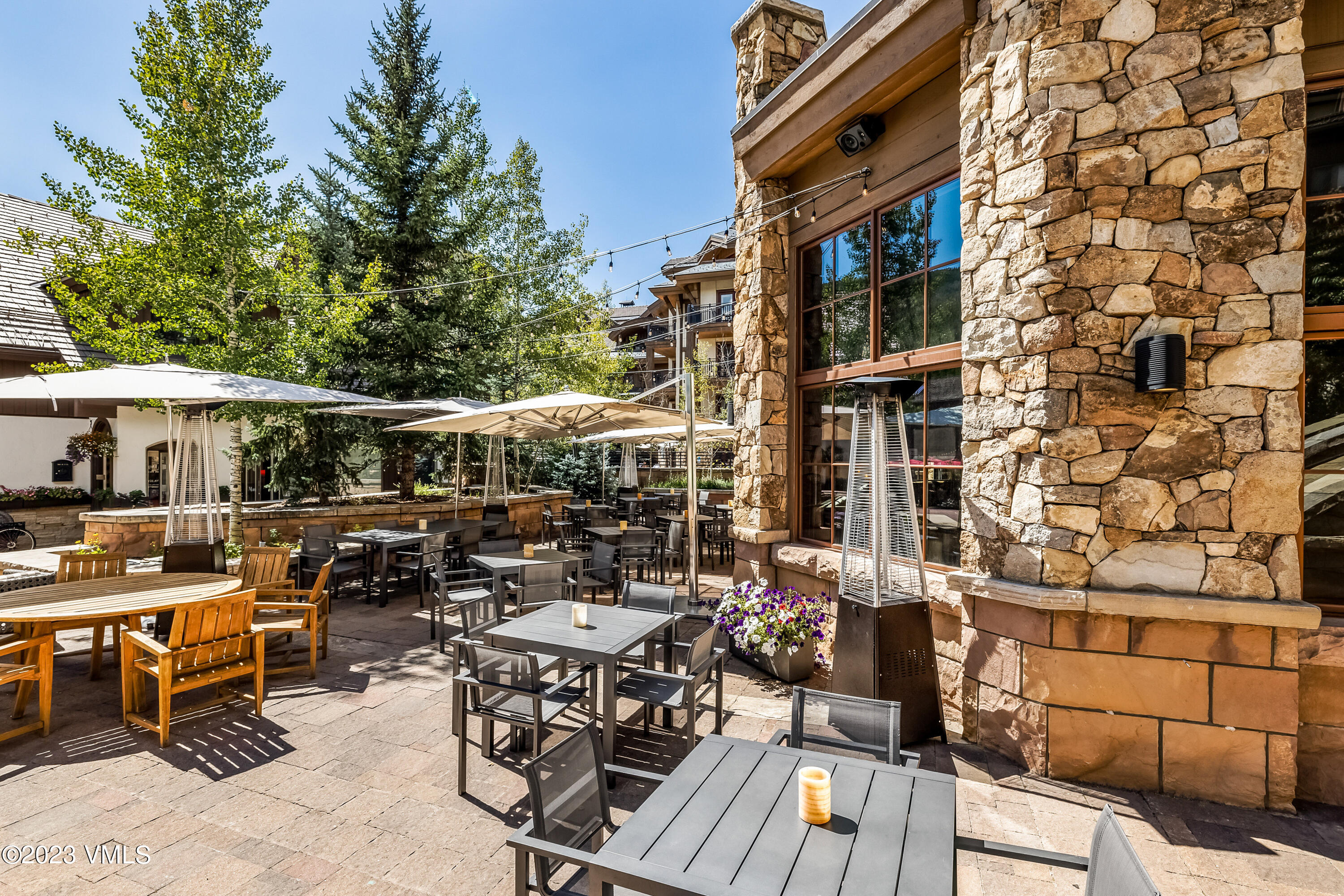 16 Vail Road, Unit RESORT MEMBERSHIP Vail, CO 81657 - Photo 38 of 51 a view of a tables and chairs in patio of the house