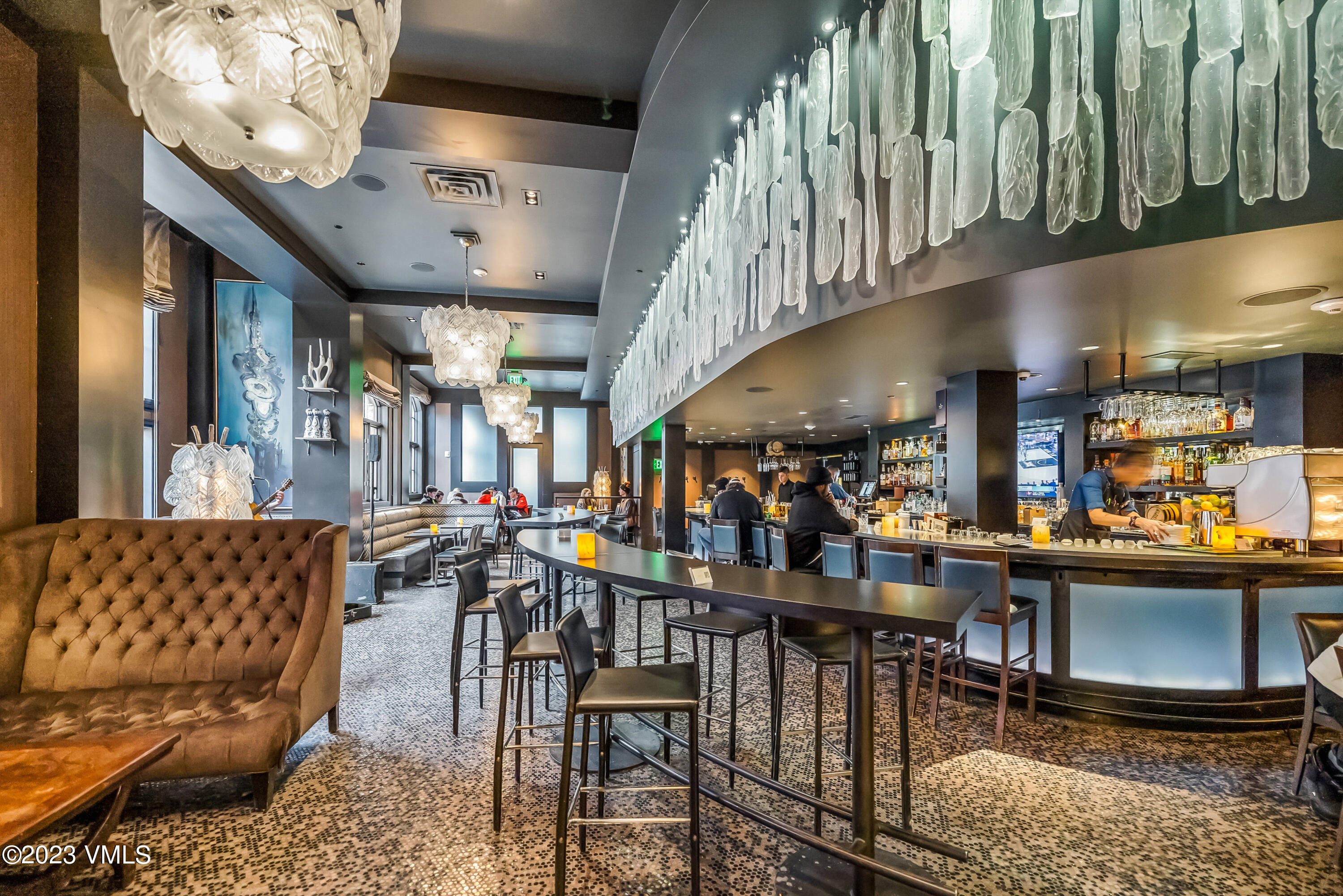 16 Vail Road, Unit RESORT MEMBERSHIP Vail, CO 81657 - Photo 44 of 51 a view of a chairs and tables in a building