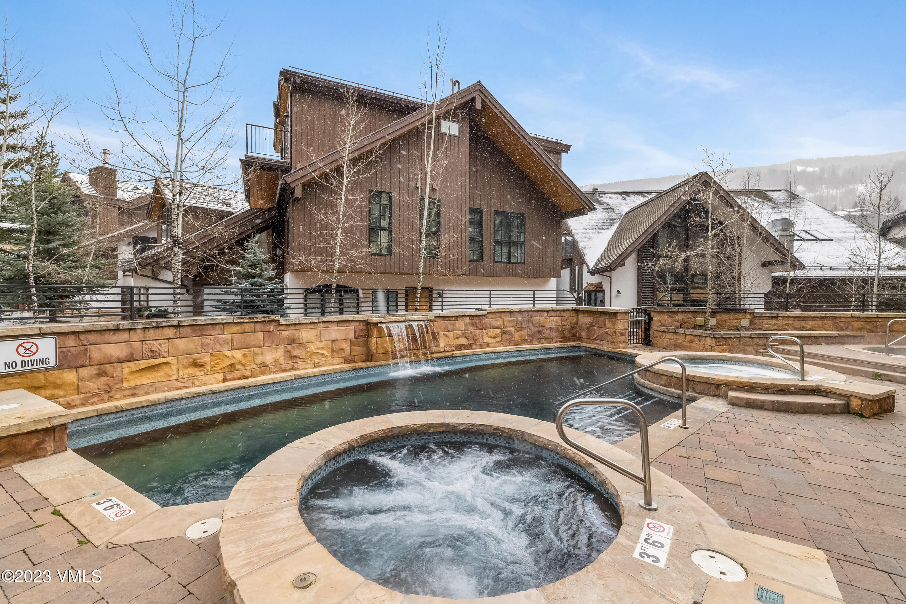 16 Vail Road, Unit RESORT MEMBERSHIP Vail, CO 81657 - Photo 50 of 51 a view of a house with swimming pool