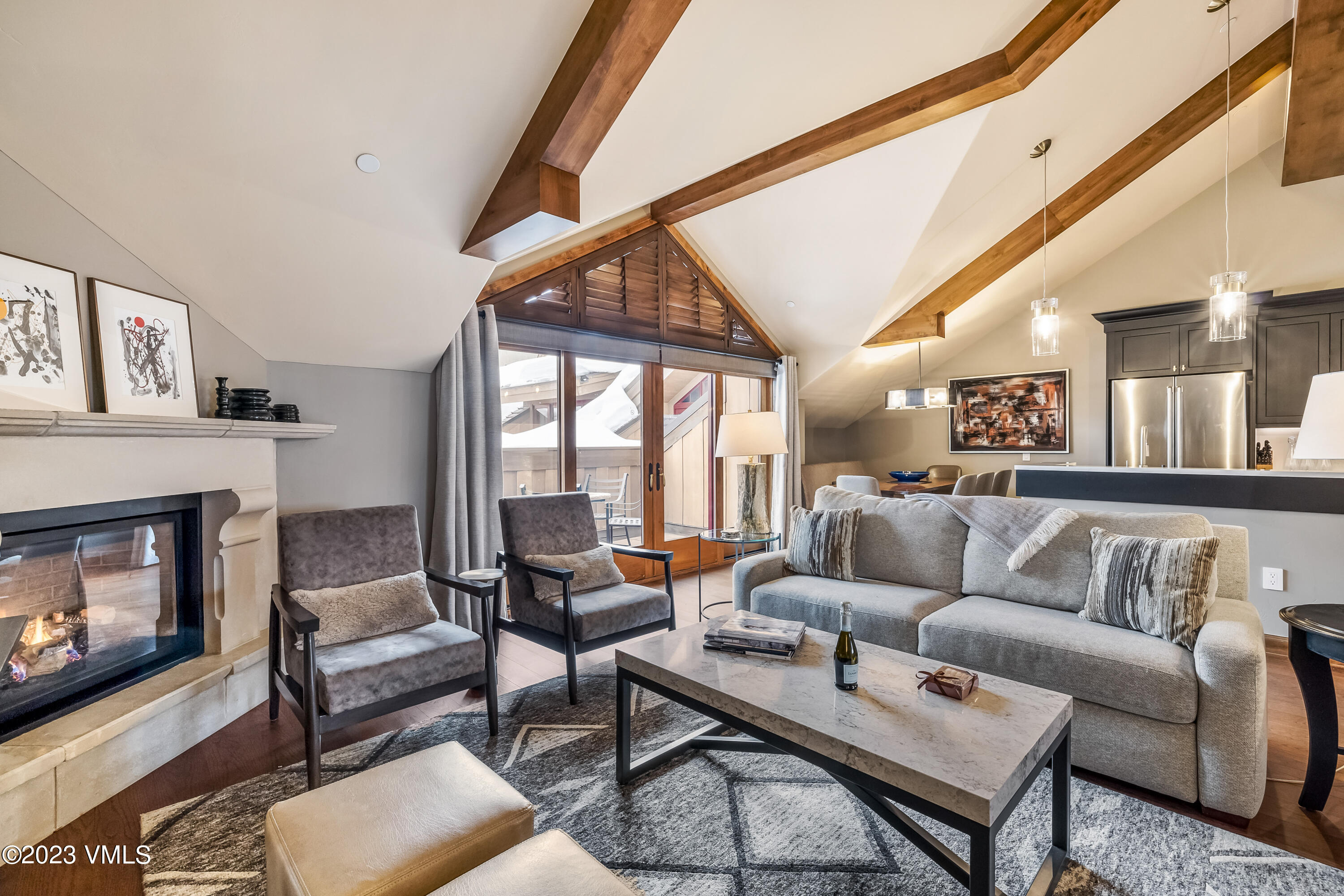16 Vail Road, Unit RESORT MEMBERSHIP Vail, CO 81657 - Photo 5 of 51 a living room with furniture and a fireplace