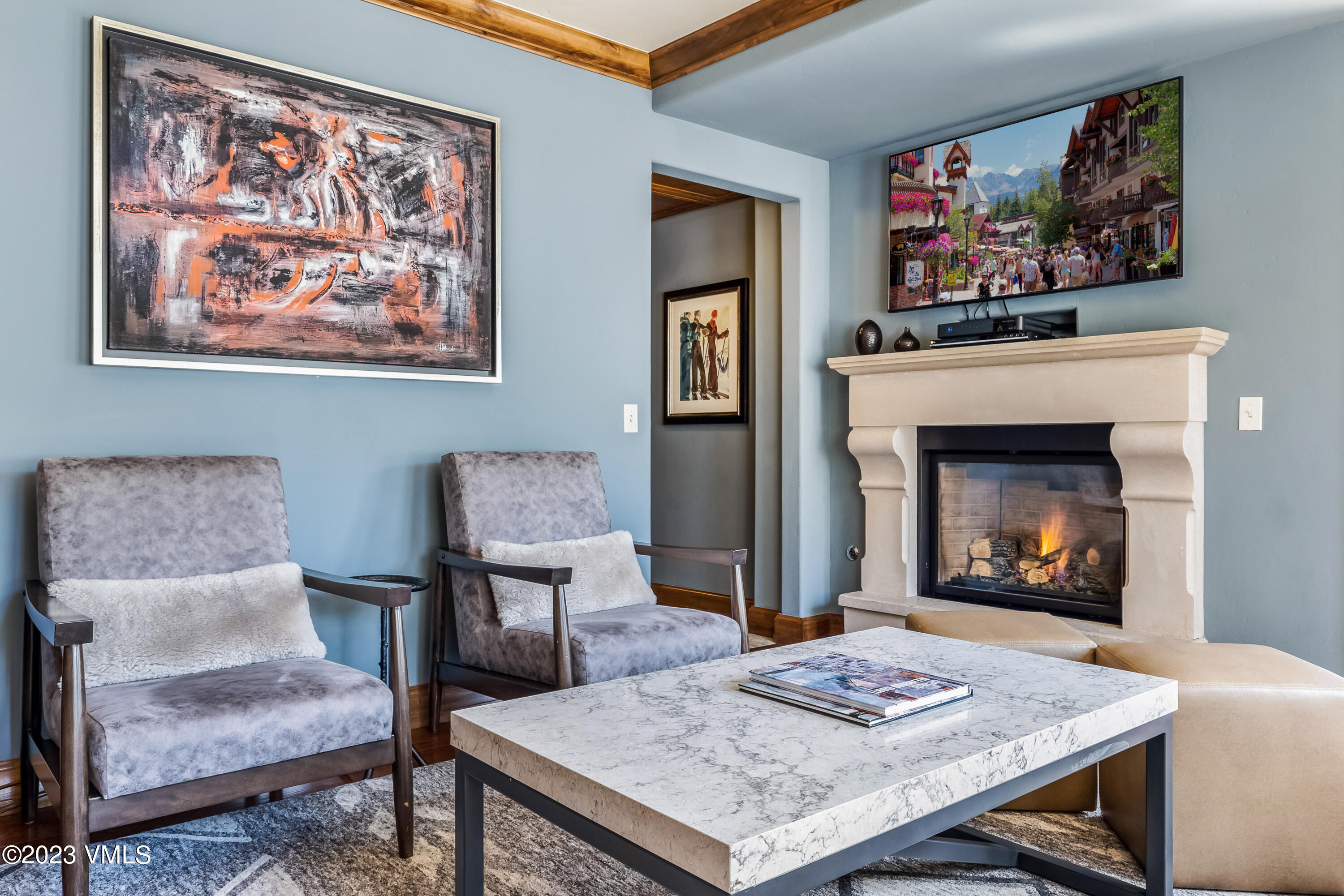 16 Vail Road, Unit RESORT MEMBERSHIP Vail, CO 81657 - Photo 9 of 51 a living room with furniture and a fireplace